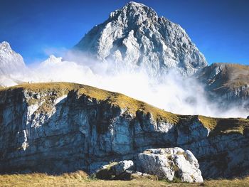 Scenic view of snowcapped mountains against sky