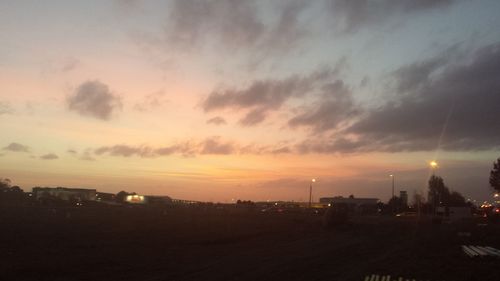 View of illuminated city at sunset