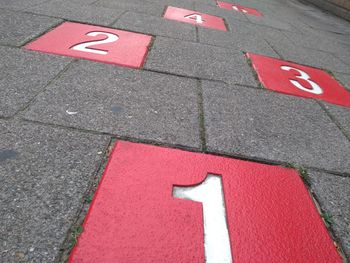 High angle view of arrow sign on street