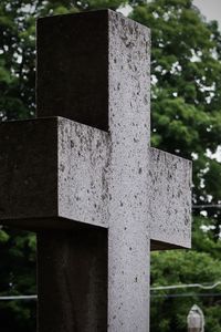 Close-up of cross in cemetery