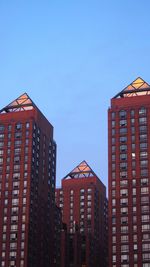 Low angle view of building against clear blue sky