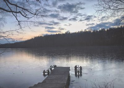 Scenic view of lake against sky during sunset
