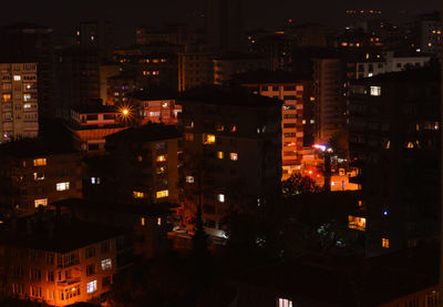 High angle view of illuminated buildings at night