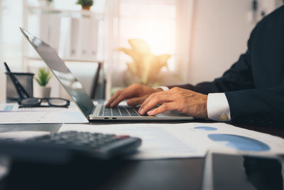 Man using laptop on table