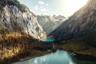 Scenic view of lake and mountains against sky