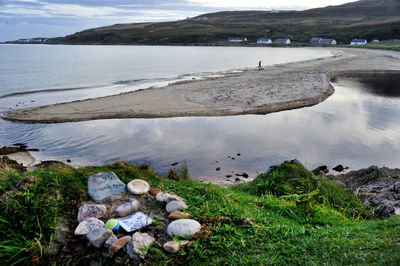 High angle view of rocks by sea against sky