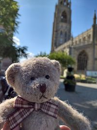 Close-up of stuffed toy on building