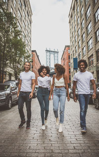 People walking on street in city