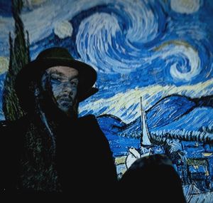 Rear view of silhouette man painting