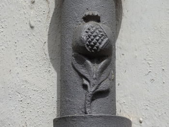 Close-up of human hand on sand