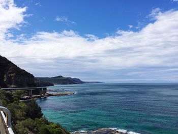 Scenic view of sea against cloudy sky