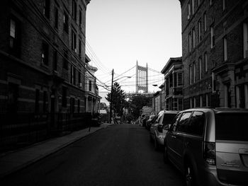 Road in city against clear sky