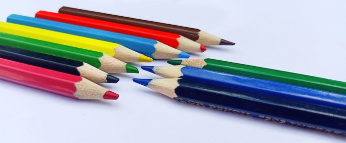 Close-up of colorful pencils on white background