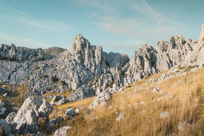 Panoramic view of rocky mountains against sky