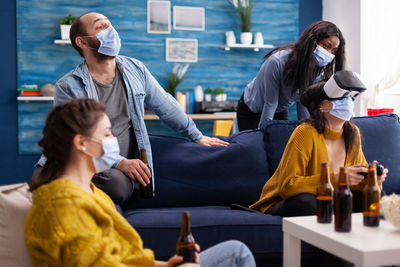 People wearing mask enjoying at home