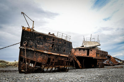 Abandoned ship against sky
