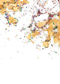 High angle view of multi colored pencils on white background