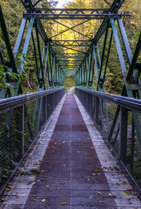 View of footbridge along plants