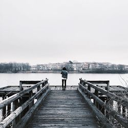 Man standing on pier