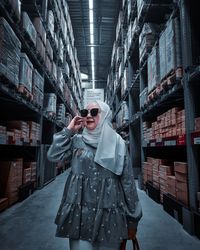 Portrait of woman standing in store