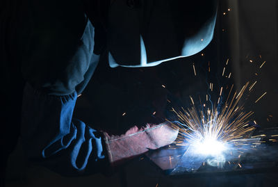 Welder welding metal in industry