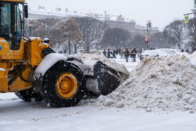 Saint-petersburg, russia. - december 04, 2021. snow-plowing equipment taking part in snow removal 