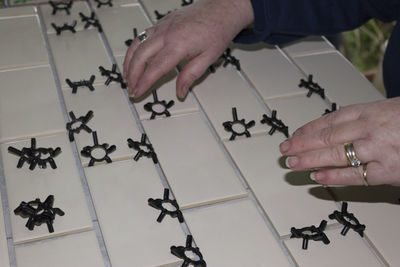 Close-up of hands on table