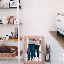 Rear view of people standing at home