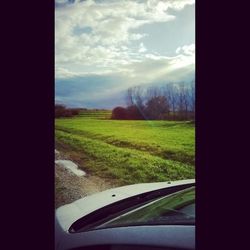 Scenic view of landscape against cloudy sky