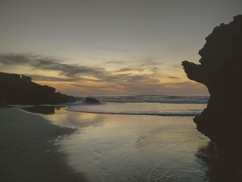 View of beach at sunset