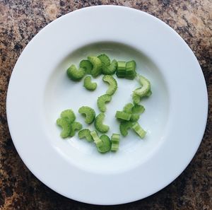 Directly above shot of chopped celery in plate