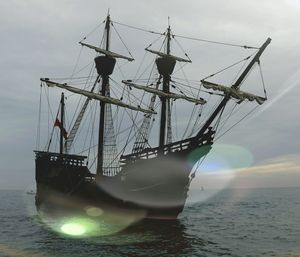 Sailboat in sea against sky