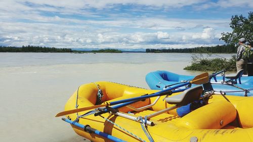 Cropped canoes at countryside lake