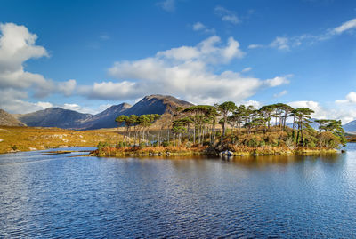 Scenic view of lake and mountains against sky