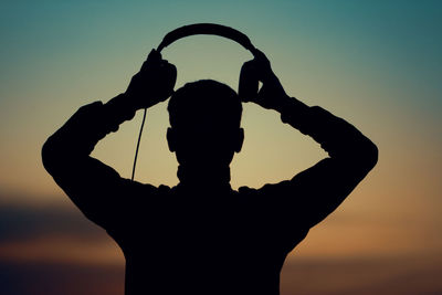 Portrait of a dj wearing headphones
