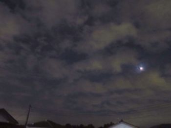 Low angle view of moon at sunset