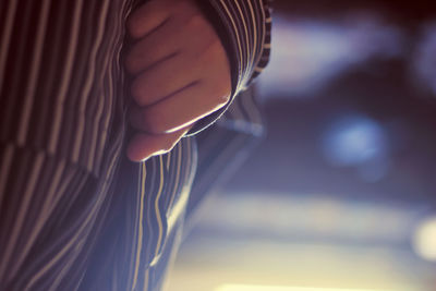 Close-up of hand against blurred background