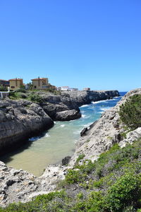 Scenic view of sea against clear blue sky