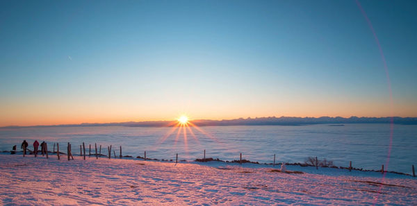 Scenic view of sea against clear sky during sunset