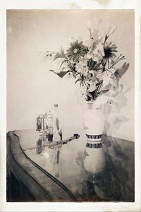 Digital composite image of flower vase on table