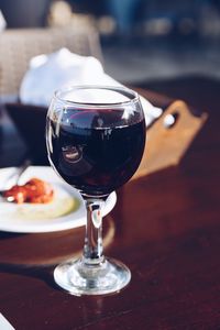 Close-up of wineglass on table