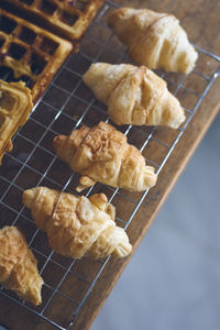 Close-up of croissants on grille