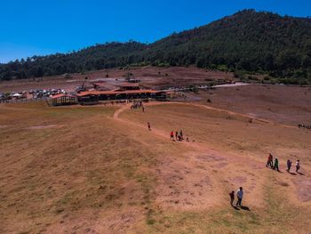 People on field against sky