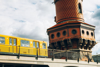 Low angle view of building against cloudy sky