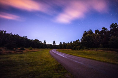 Road passing through field