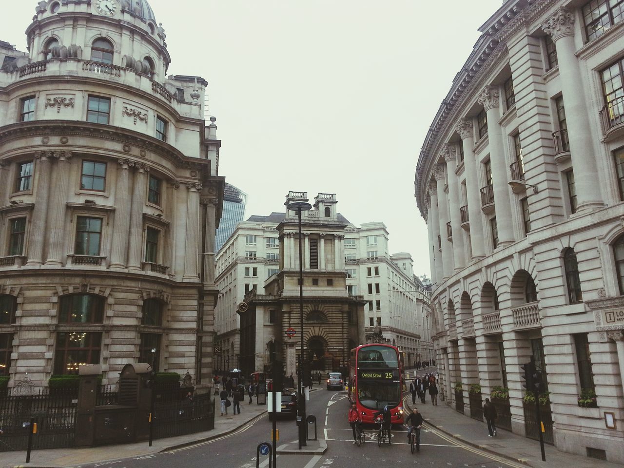 architecture, building exterior, built structure, city, clear sky, street, incidental people, travel, travel destinations, transportation, famous place, car, land vehicle, history, capital cities, building, city life, tourism, city street, mode of transport