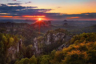 Scenic view of rocky mountains during sunset