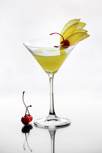 Close-up of wineglass on white background