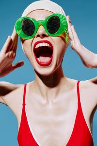 Portrait of young woman wearing sunglasses