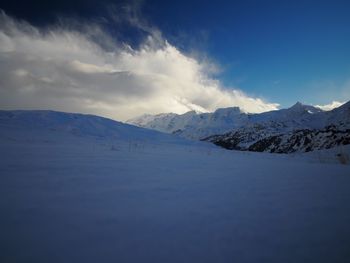 Scenic view of mountains against sky during winter